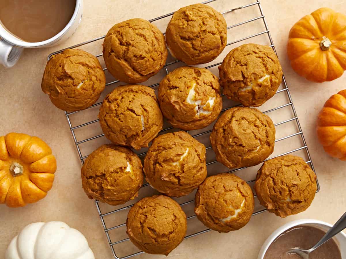 Overhead view of pumpkin muffins on a wire cooling rack.