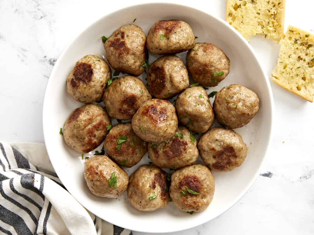 Overhead view of a bowl full of turkey meatballs with no sauce. 