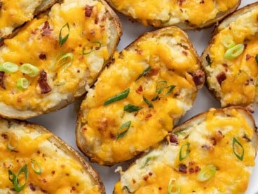 Close up overhead view of twice baked potatoes staked beside each other.