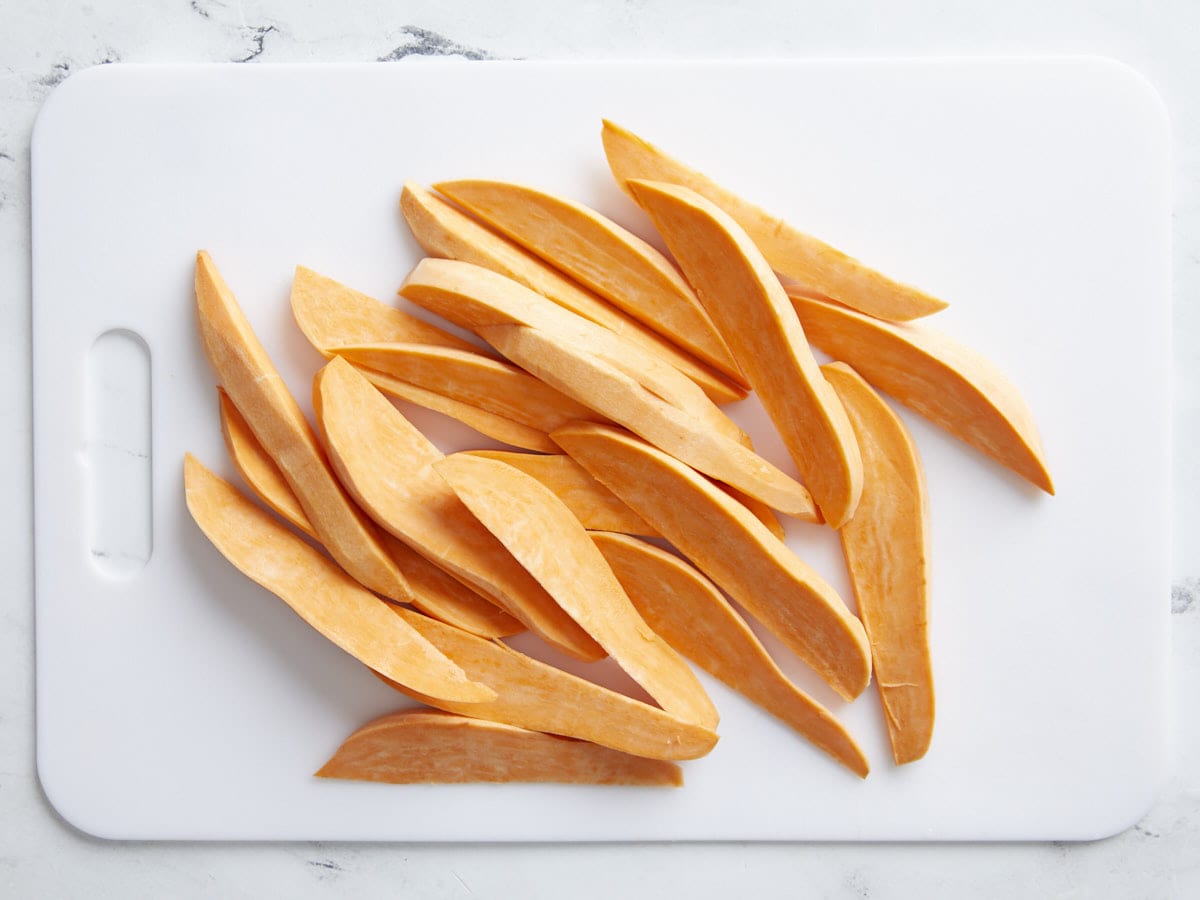 Sweet Potatoes that have been peeled and cut into wedges.