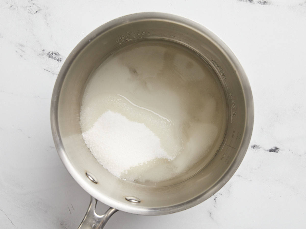 Water, sugar, and corn syrup in a pot.