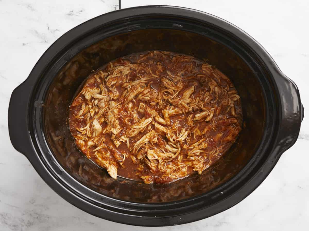 Finished shredded salsa chicken in the crock pot.