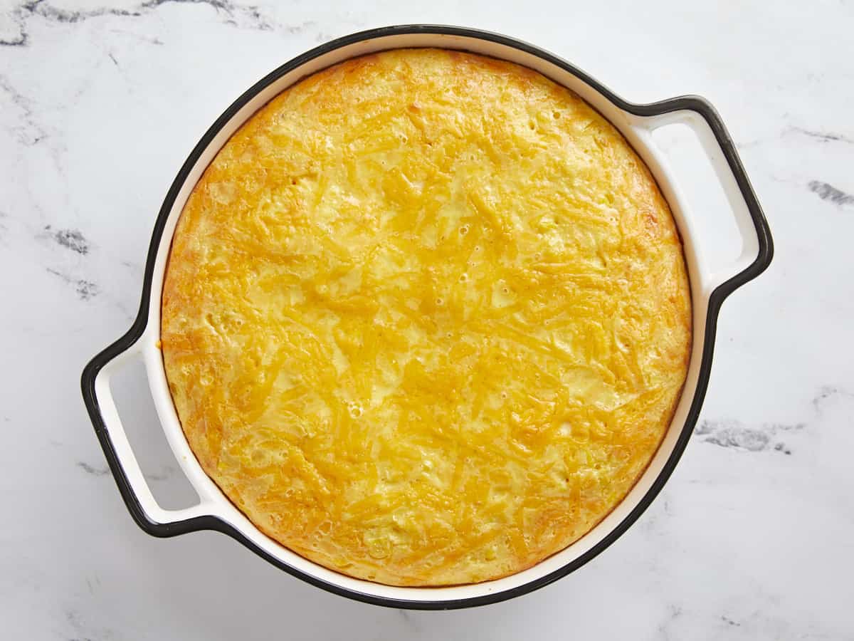 Baked corn pudding in the casserole dish. 
