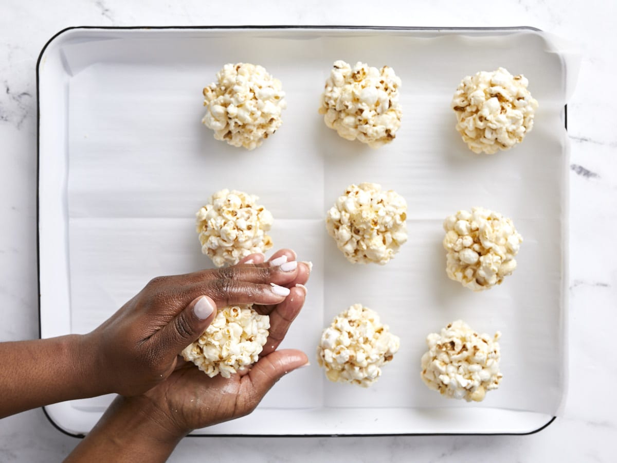 Overhead view of popcorn balls being formed.