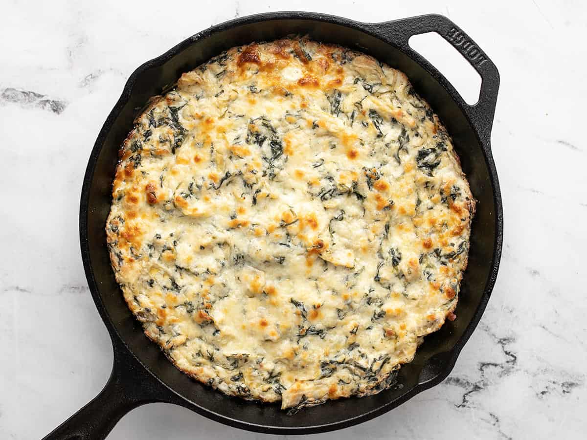 Baked spinach artichoke dip in the skillet. 