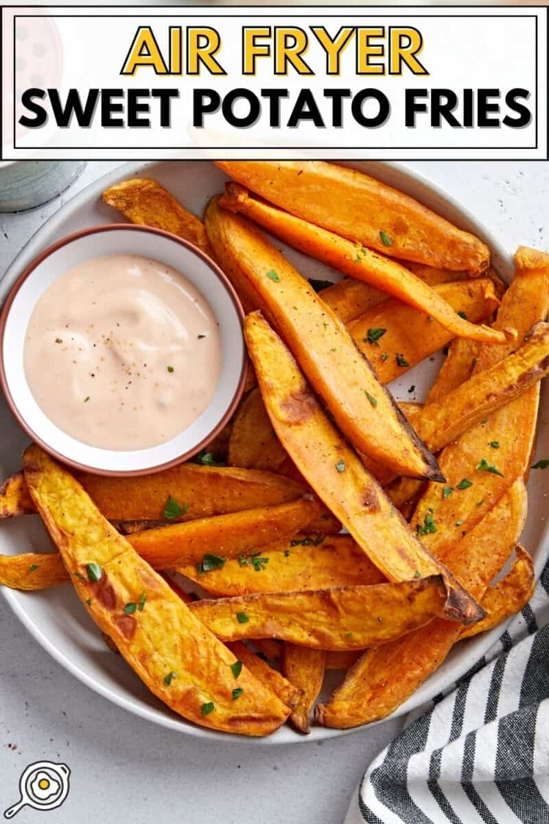 Overhead view of a plate of sweet potato fries with mayo ketchup dipping sauce and title text at the top.