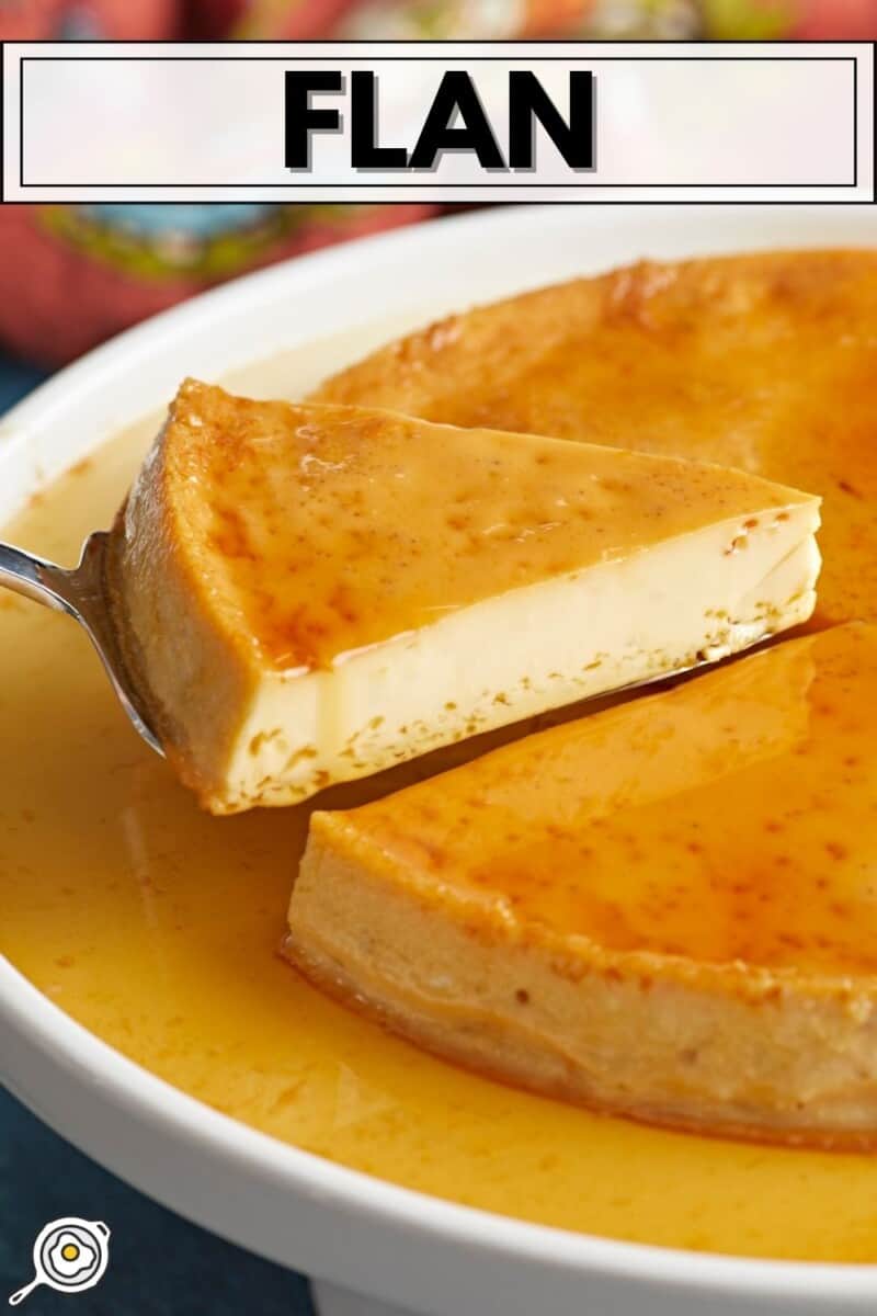 Side view of a slice of flan being lifted from the plate.