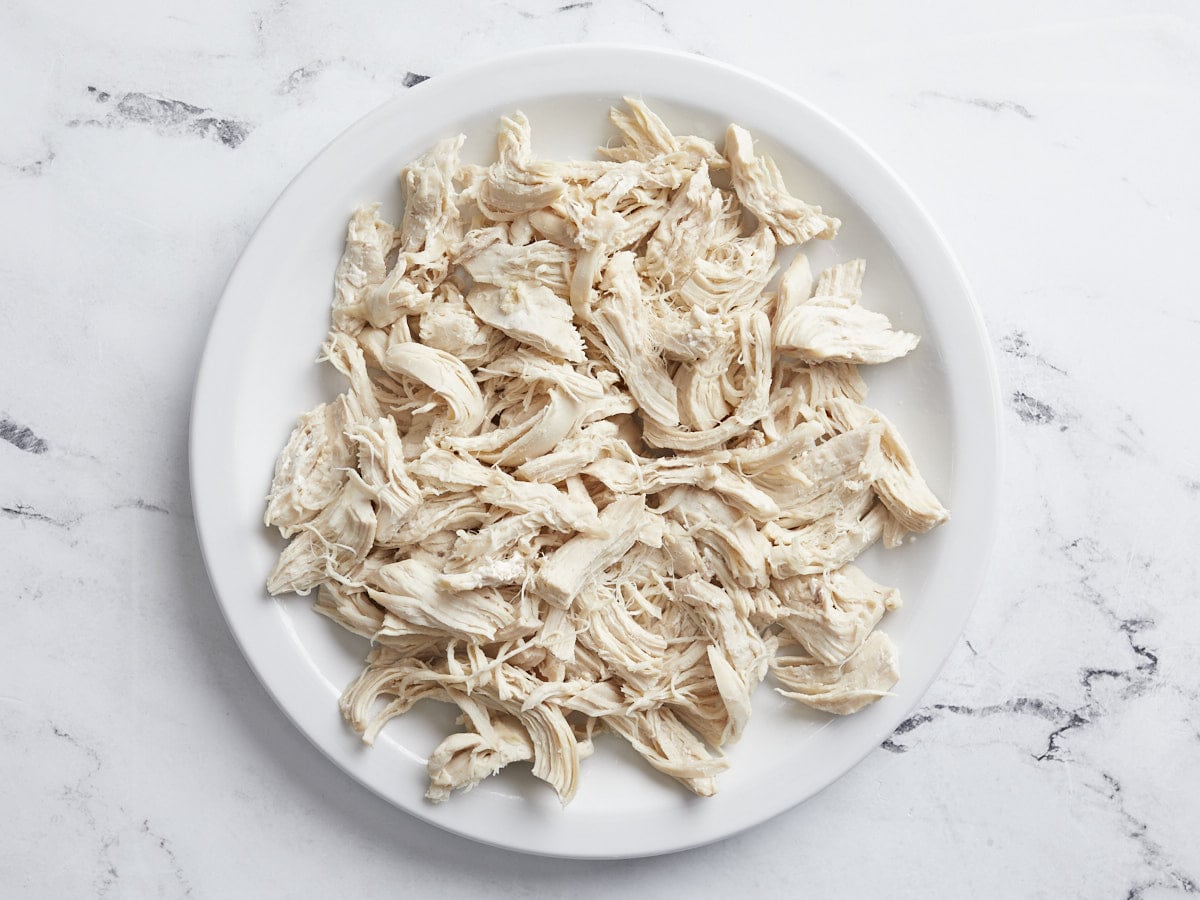 Overhead view of shredded chicken on a plate