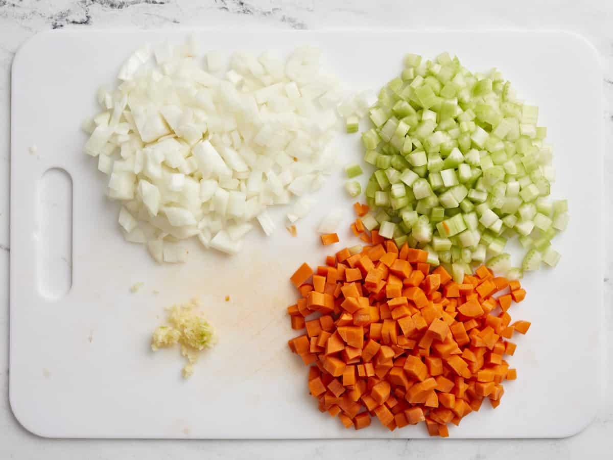 Chopped Vegetables for Italian Wedding Soup on a cutting board.
