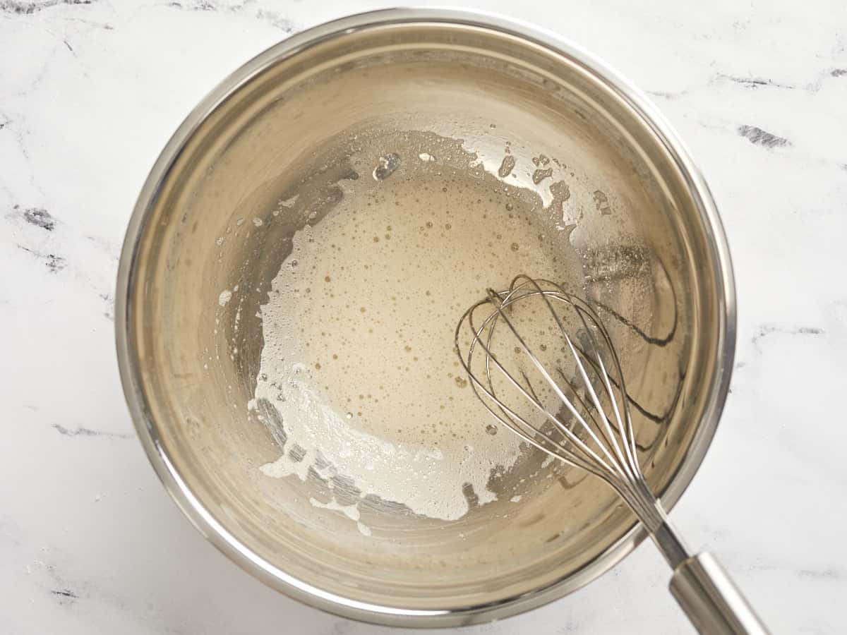 Lightly whisked egg white with vanilla extract.