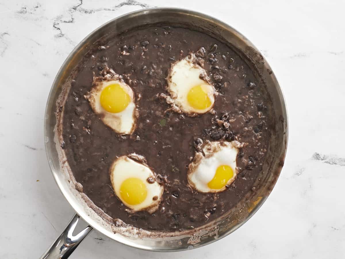 Cooked eggs in the black beans. 