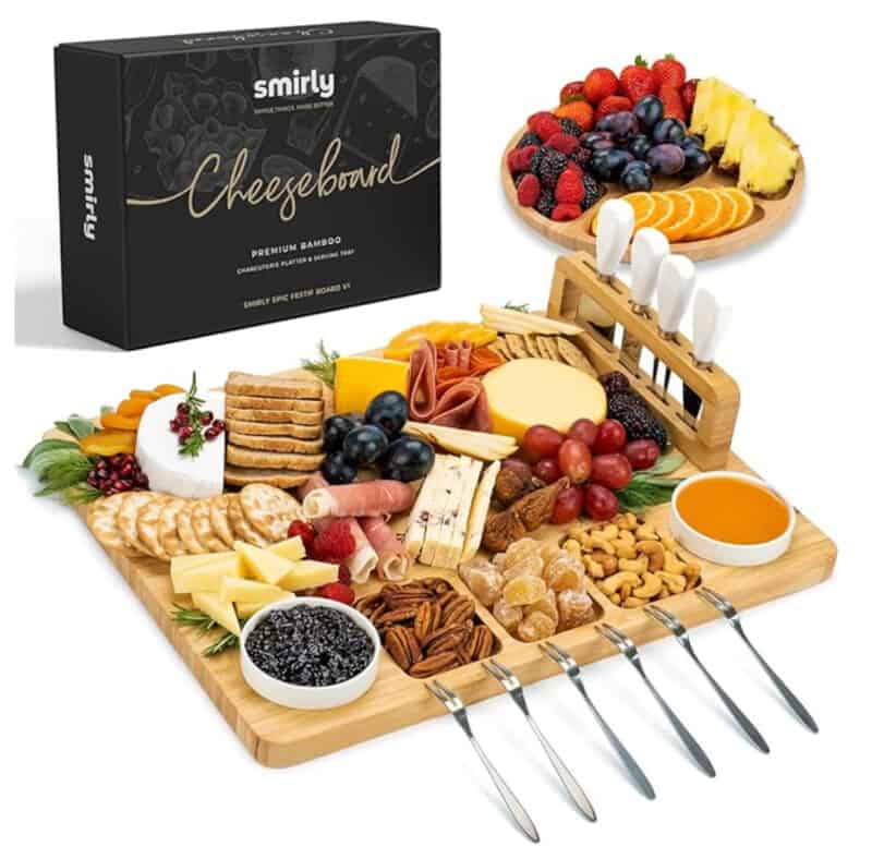 Product image for a charcuterie set including wooden board, bowls, forks, and cheese knives. 