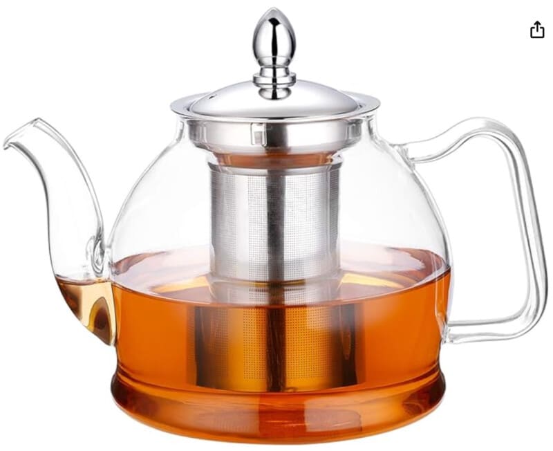 Glass teapot with metal strainer. 