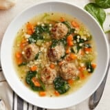 Overhead view of a bowl full of Italian Wedding Soup.