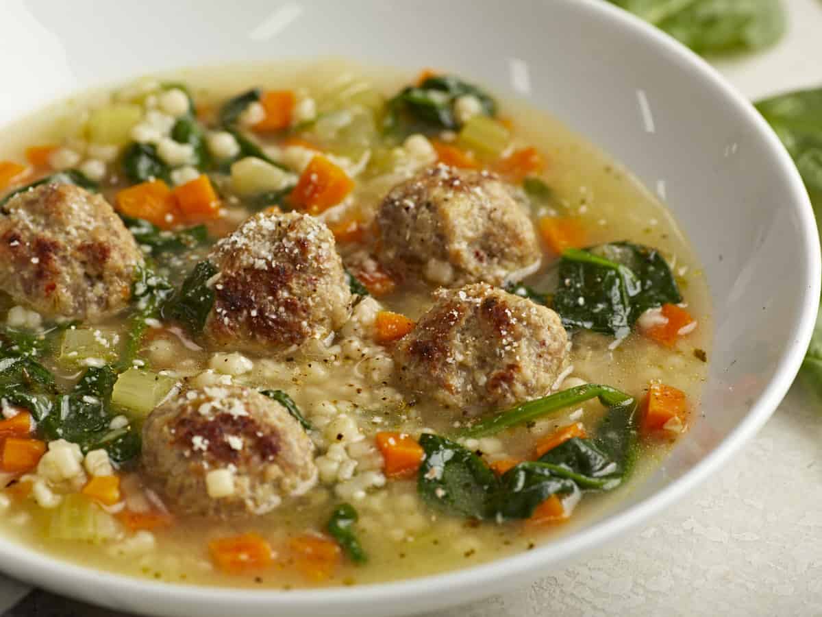 Side view of Italian Wedding Soup in a bowl. 