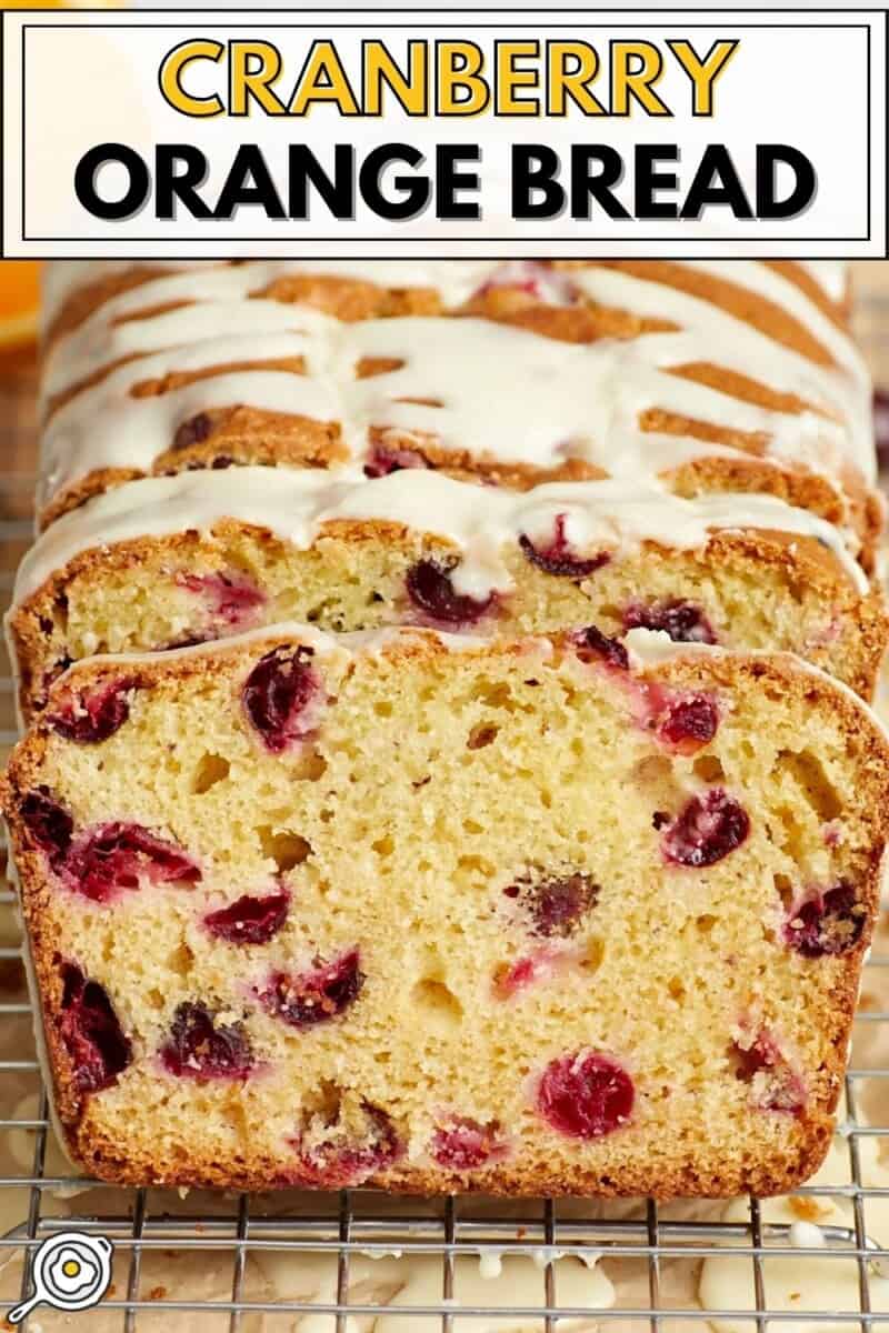 Front view of a sliced loaf of cranberry orange bread.