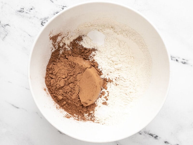 Dry ingredients for crinkle cookies in a white bowl. 