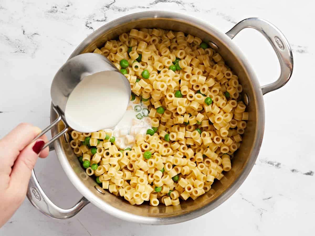 Pasta and cream added to the pot with the ham.