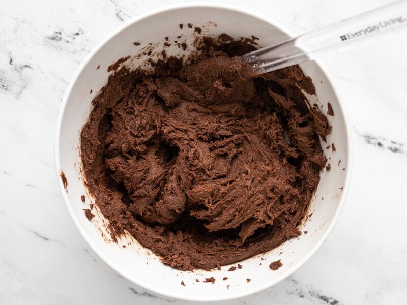 Finished cookie batter in the bowl with a spatula.