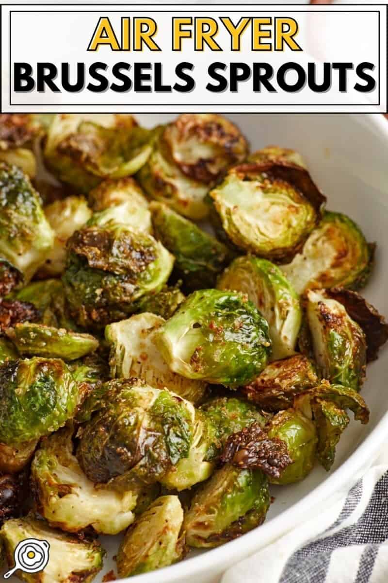 Side view of Air Fryer Brussels Sprouts in a white serving dish with title text at the top.