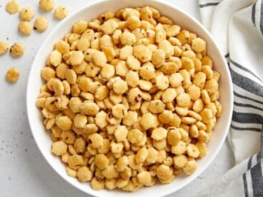 Overhead photo of ranch oyster crackers in a white serving bowl.