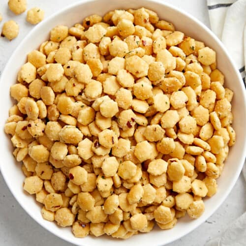 Overhead photo of ranch oyster crackers in a white serving bowl.