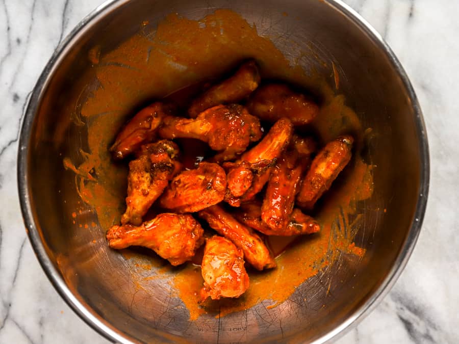 buffalo wings in a metal bowl.