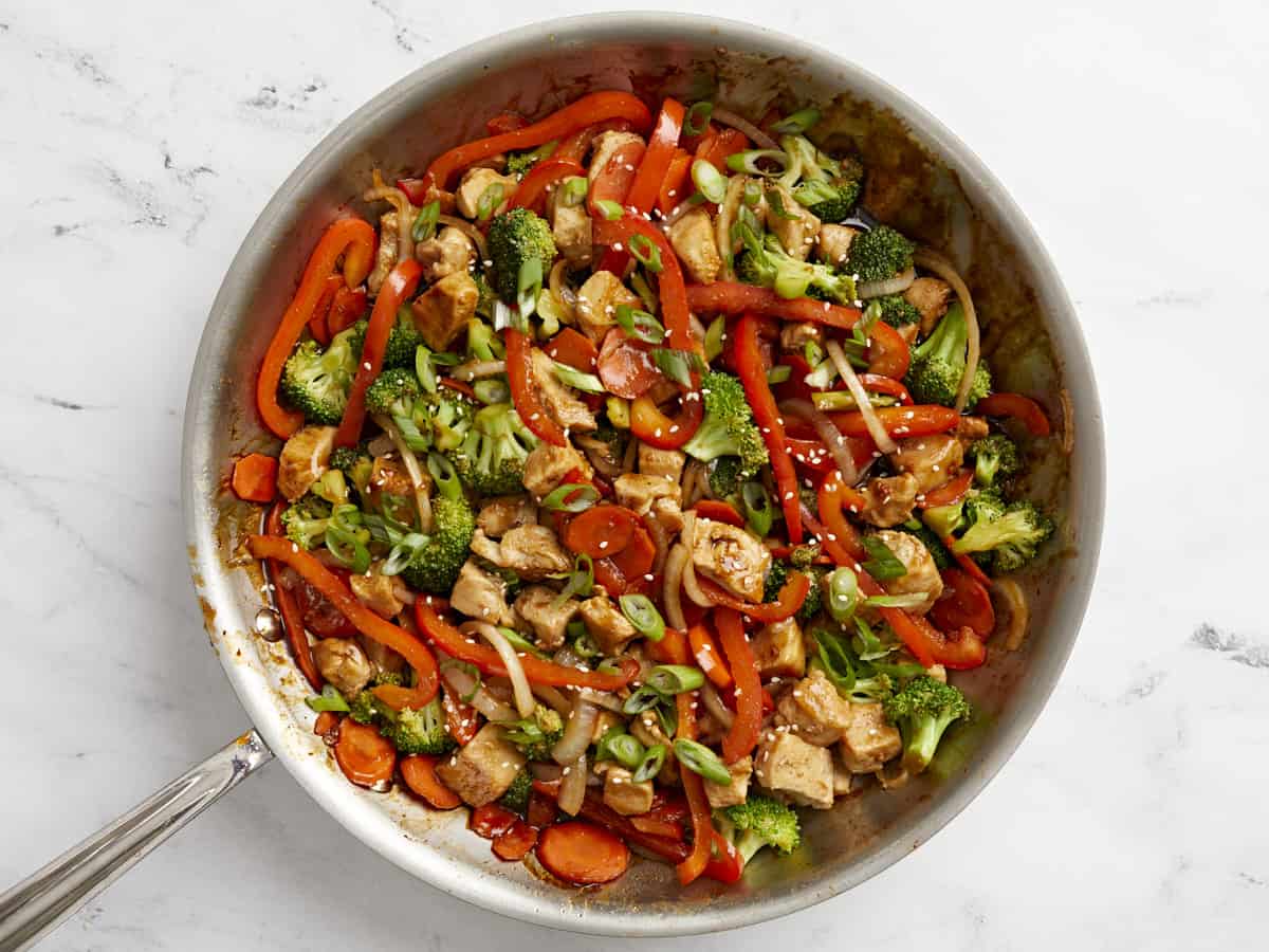 Finished chicken stir fry in a skillet.