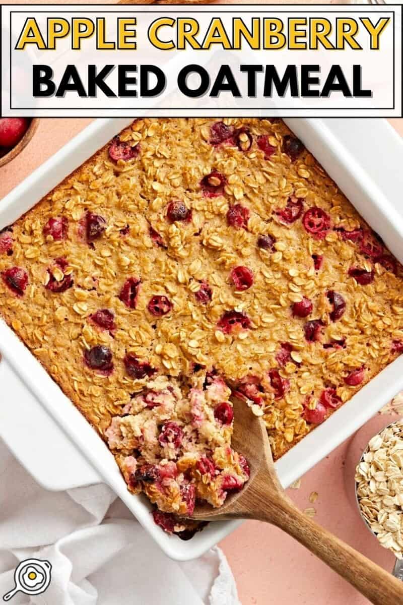 Overhead view of apple cranberry baked oatmeal being scooped out of the casserole dish.