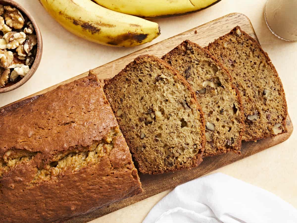 Overhead view of a sliced loaf of banana bread. 