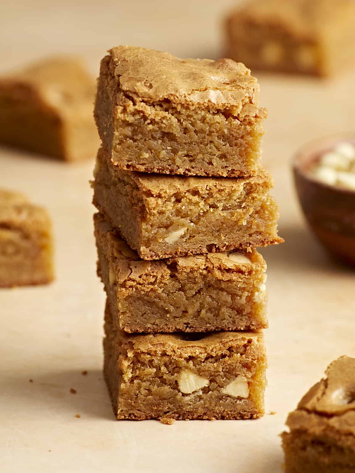 Side close up view of four blondie bars stacked on top of each other.