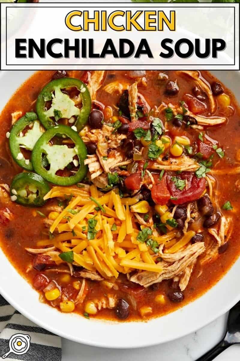 Overhead view of Chicken Enchilada Soup in a white bowl with title text at the top.