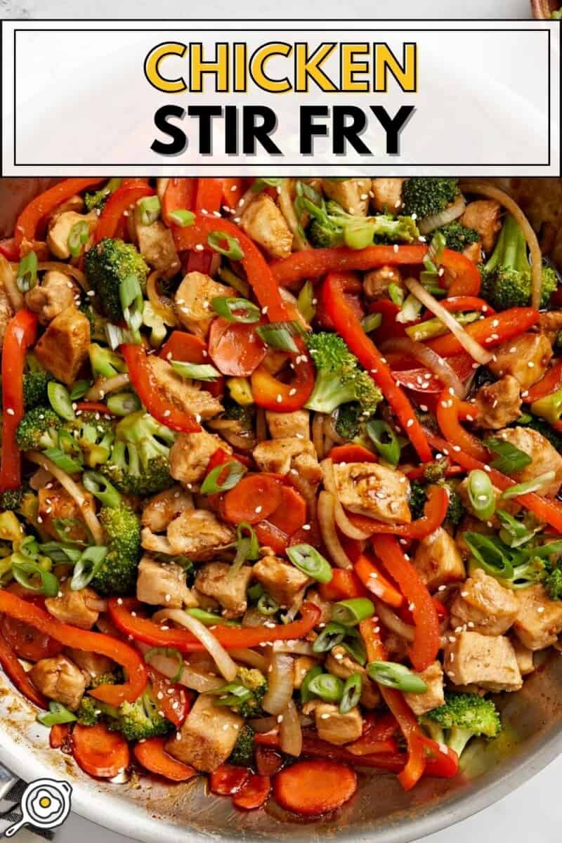 Overhead view of chicken stir fry in a skillet with title text at tthe top.
