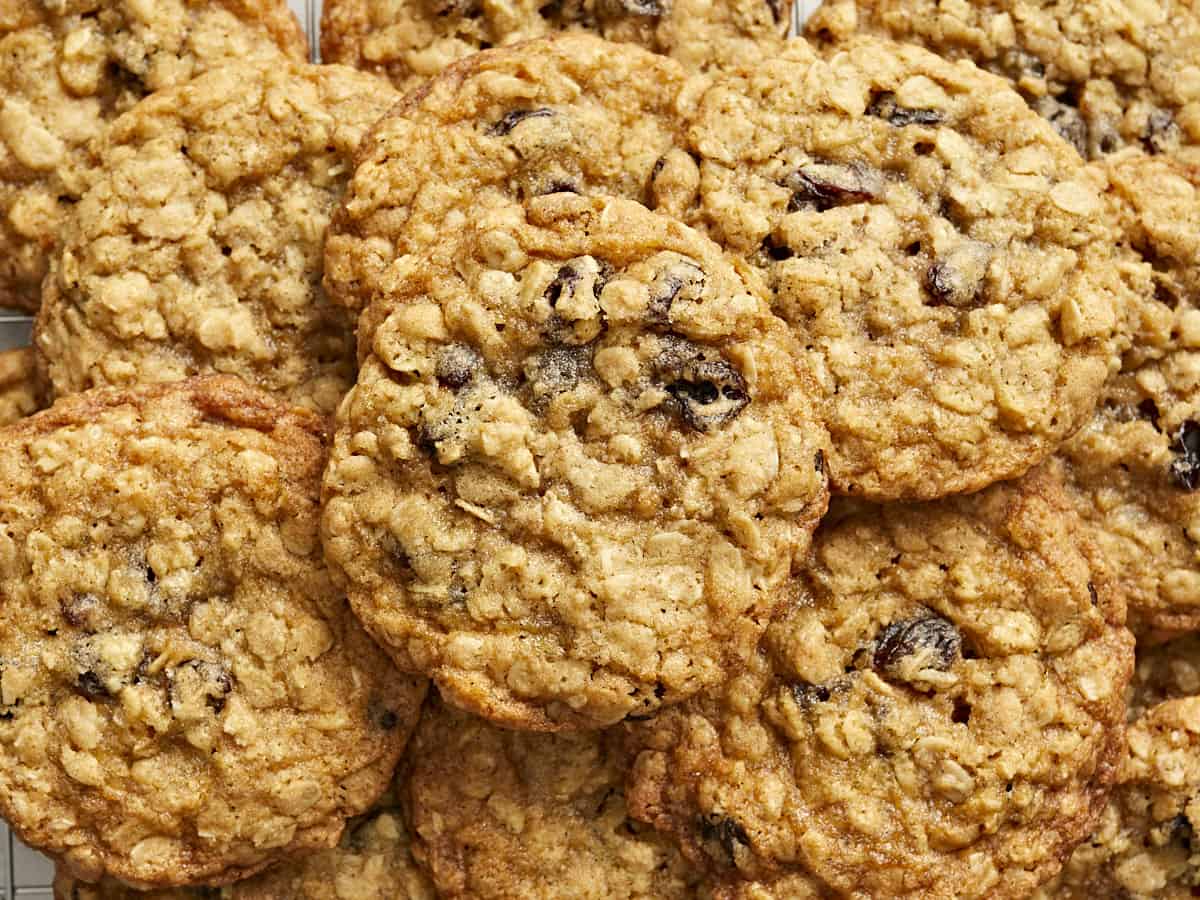 Very close up view of a pile of oatmeal cookies.