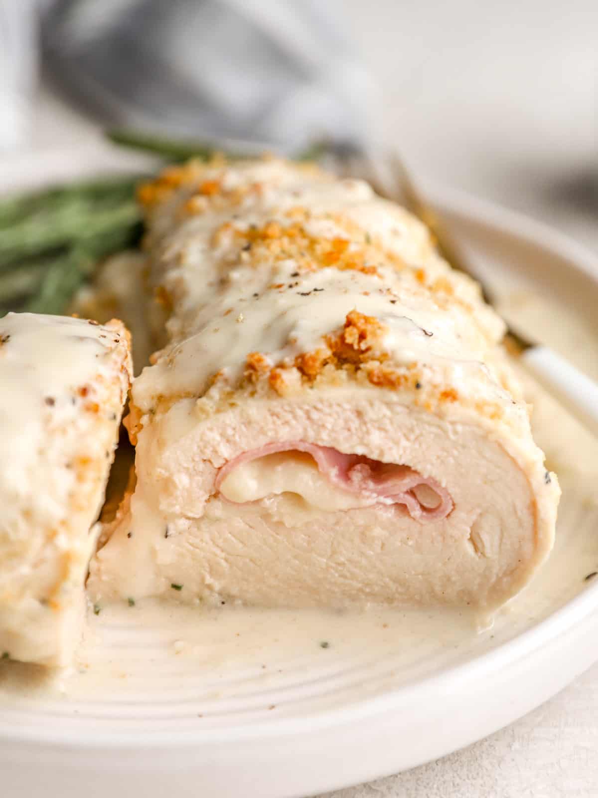 close-up view of a sliced chicken cordon bleu breast.