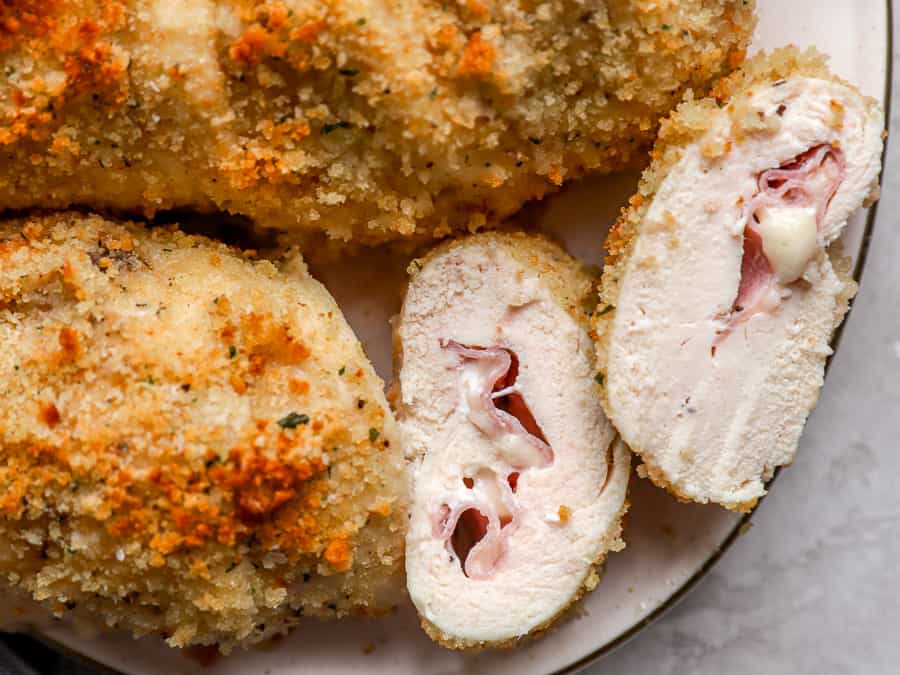 overhead view of slices of chicken cordon bleu on a plate.