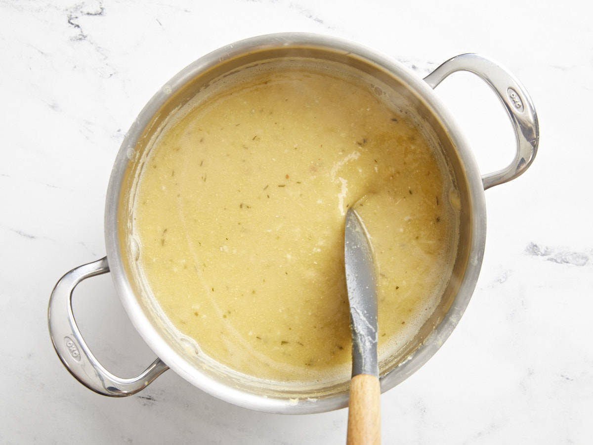 Finished soup being stirred in the pot.