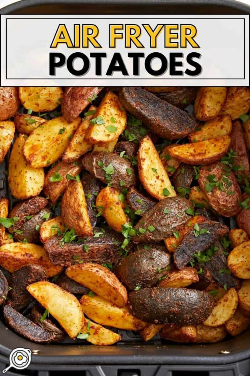 Overhead view of air fryer potatoes garnished with parsley with title text at the top.