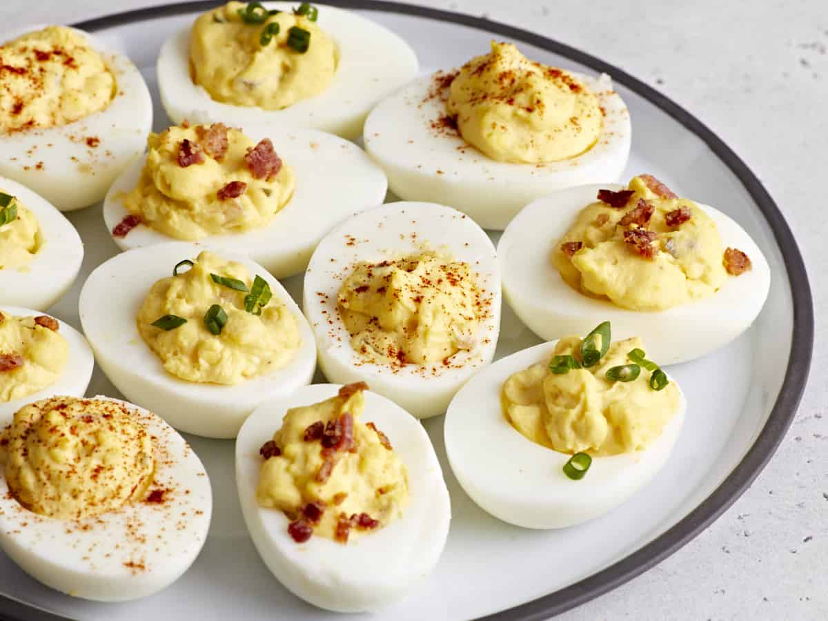 Side view of deviled eggs on a serving platter.