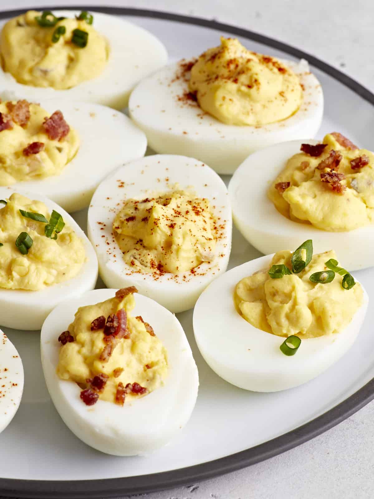 Side view of deviled eggs on a serving platter.