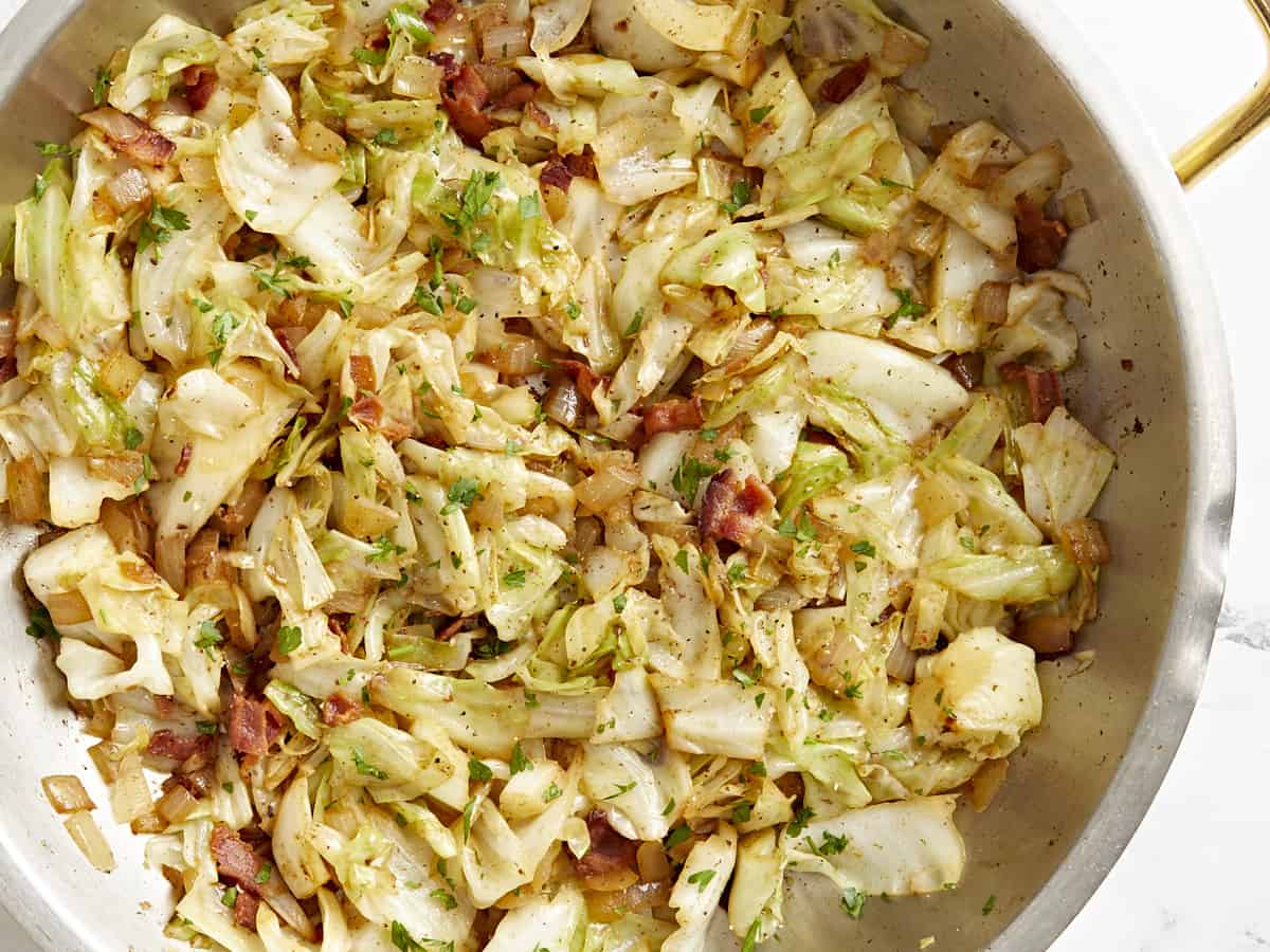 Close up overhead view of fried cabbage in a skillet.
