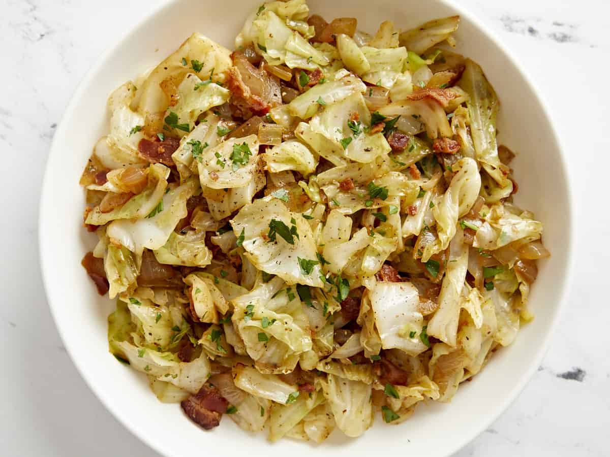 Overhead view of fried cabbage in a bowl.