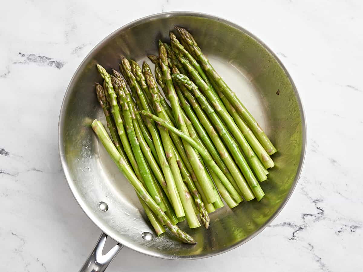 asparagus in a frying pan.