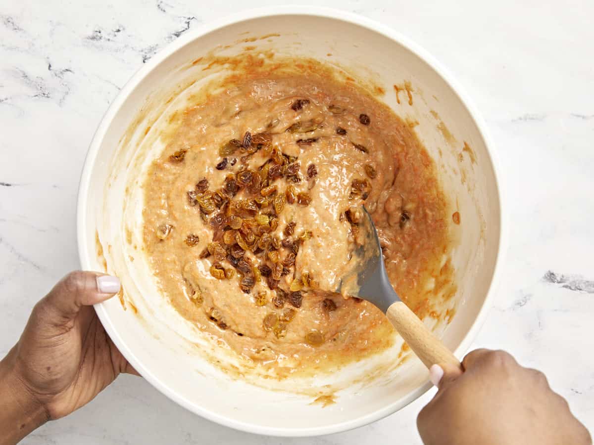 Golden raisins are added to the carrot cake muffin batter.
