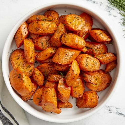 Overhead view of Air Fryer Carrots in a white serving dish.