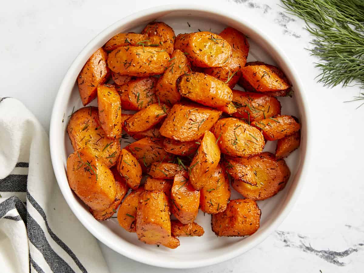 Top view of air fryer carrots in a white serving dish.