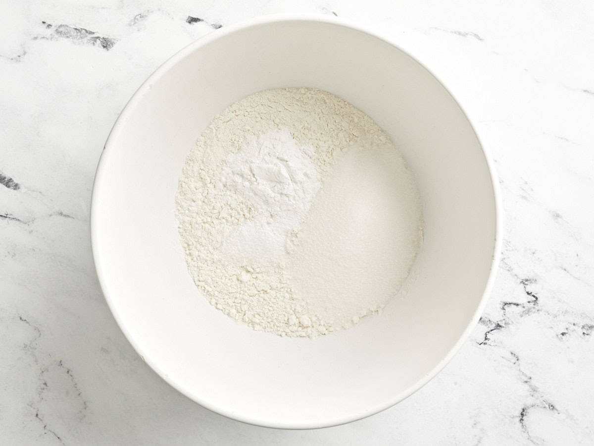 Dry ingredients in a bowl for sheet pan pancakes.