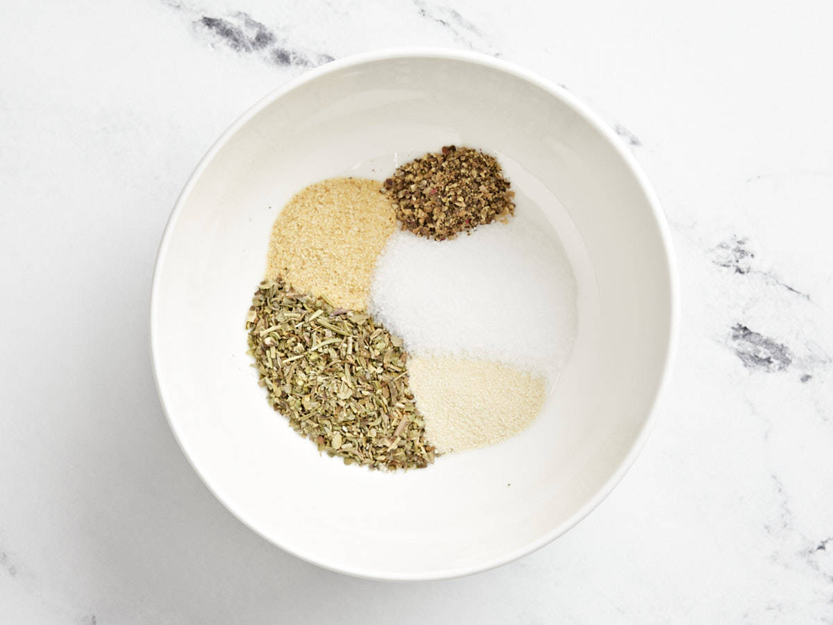 Overhead view of spice ingredients for porcupine meatballs.