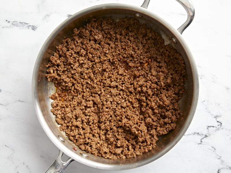 cooked seasoned ground beef in a frying pan.