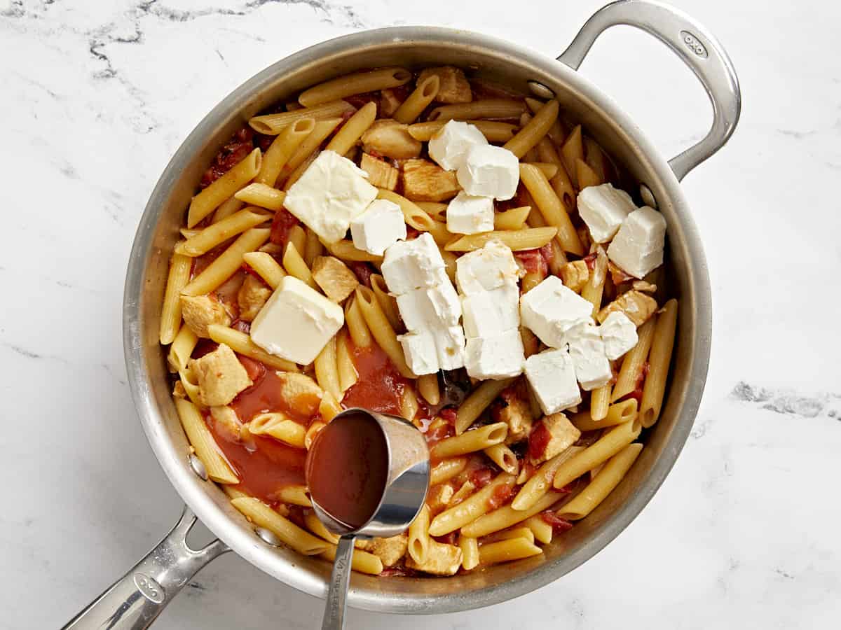 Cream cheese, hot sauce, butter, and Worcestershire added to the skillet.